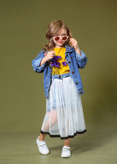 portrait of little model girl in studio