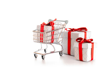 Xmas sale. Trolley cart for supermarket with christmas or birthday gift box isolated on white...