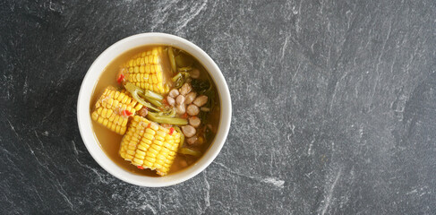 sayur asem with corn, kale and peanuts, served in a soup, tasty and delicious