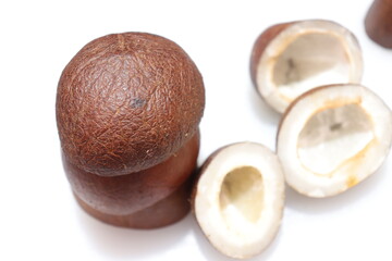Close up view of dried coconut chips on white background in india