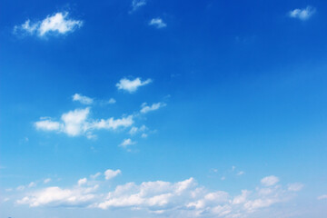 Blank sky surface with small clouds