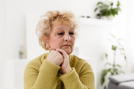 Portrait Of Senior Woman With Green Sweater