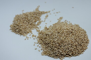 Organic natural Til Gul OR Sesame seeds over white background

