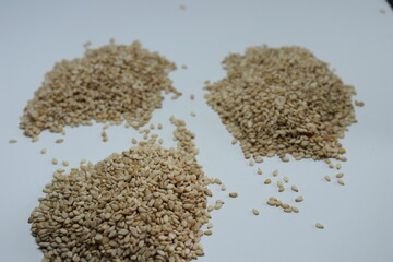 Organic natural Til Gul OR Sesame seeds over white background


