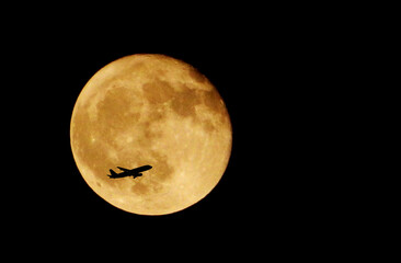 Flight Silhouette over the moon/ Planes flying in front of full moon/ Flight moves across full moon