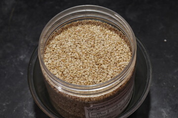 Organic natural Til Gul OR Sesame seeds over white background