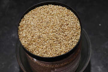 Organic natural Til Gul OR Sesame seeds over white background