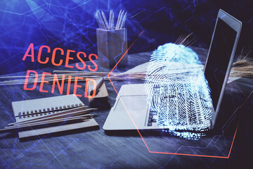 Computer on desktop in office with finger print drawing. Double exposure. Concept of business data security.
