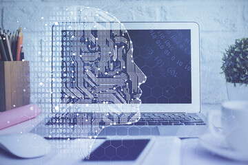 Double exposure of work space with computer and human brain drawing hologram. Brainstorm concept.