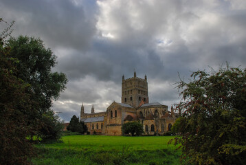 Fototapeta na wymiar Clouds over Tewkesbury Abbey in Gloucestershire, England