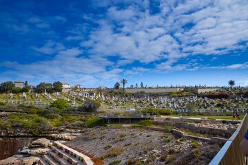 Fototapeta na wymiar Bronte Beach Cemetery sitting on top of high rock cliffs with magnificent views to the ocean 