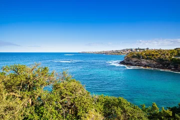 Fotobehang Gordons Bay surrounded by high rock cliffs and houses, turquoise blue waters great for swimming Sydney NSW Australia © Elias Bitar