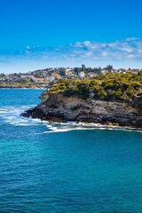 Gordons Bay surrounded by high rock cliffs and houses, turquoise blue waters great for swimming Sydney NSW Australia