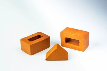 Isolated brick blocks of different shapes on a white background