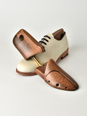 Wooden shoe lasts on a white background.