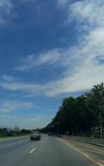 Highway road trip Social distance against COVID 19 With the beautiful sky in Thailand.