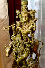 Fototapeta na wymiar A Brass Statue of lord Krishna.