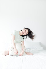Naklejka premium Asian women playing in the bedroom