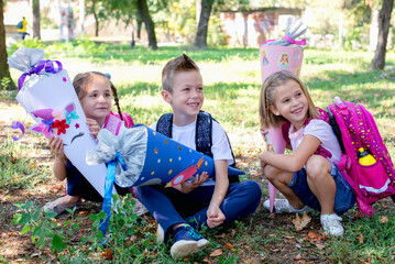 Children with School cone  in their hands. First day of school