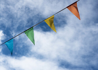 Colourful bunting flags on a blue sky 