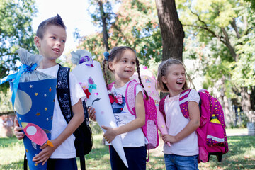 Group of small children with school bag