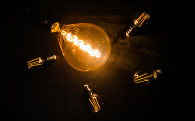 light bulbs on dark background idea and innovation
