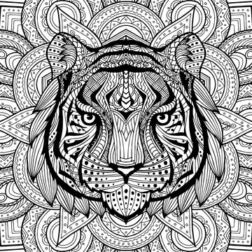 Tiger head in detailed style. Zentangle tiger. Vector pattern for tribal design. Geometric Ethnic motif with rhombus, triangles. Graphic style. Tiger for print, web, textile, wrapping paper.