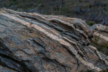 layered multi-colored gray stone in Baikal nature on a cloudy day
