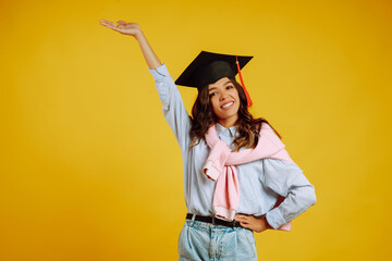 Portrait of Graduate woman in a graduation hat on her head.  Study, education, university, college,...