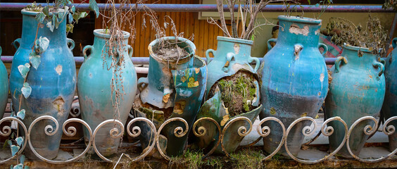 Broken amphoras, outdoor decoration of an abandoned restaurant