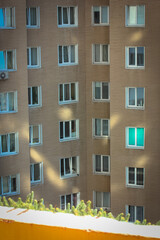 Windows in the multi-storey house, view from the balcony