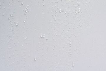 Raindrops on a light colored wall
