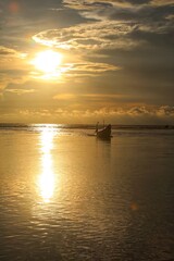 Naklejka na ściany i meble boat sails at sunset