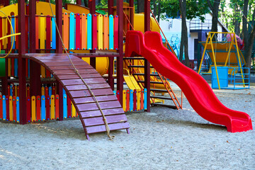 children's playground in a city Park early in the morning, various swings and carousels