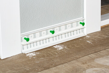 plastic white floor plinth installation