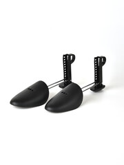Plastic shoe lasts on a white background.
