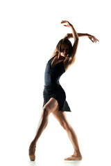 Obraz premium female ballet dancer posing on white background