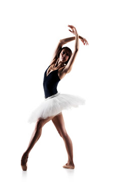 Female ballet dancer wearing tutu. Prima ballerina posing on white background
