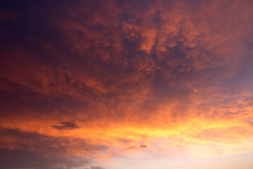 Naklejka na ściany i meble Beautiful dramatic sky at sunset. Evening sky view.