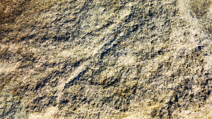 Stone background of mottled granite igneous rock used in construction, as a finishing material for kitchen countertops, etc.