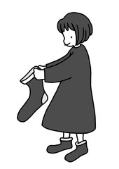 クリスマスプレゼントをもらうために大きな靴下を準備する女の子のイラスト
