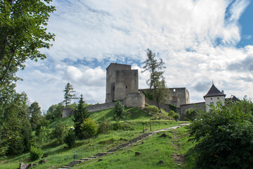 Fototapeta na wymiar landstejn, Czech Republic. The main subject is out of focus, old stone castle summer blue sky tourism medieval tower