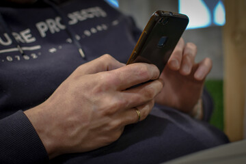 Male hands working with a mobile phone