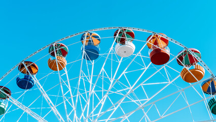 summer attraction in the amusement park ferris wheel against