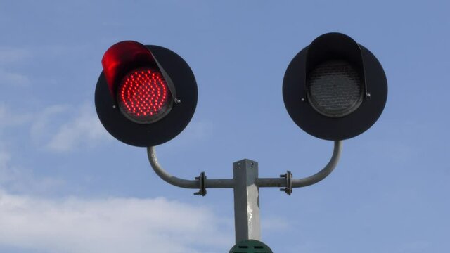 Red signal of the semaphore on the railway.