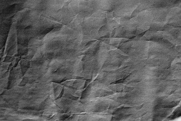 Dark grey crumpled background paper texture