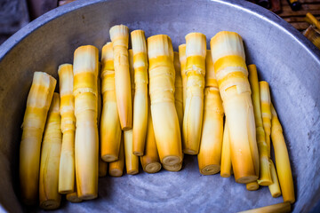 Abstract blur background view of hand peeling bamboo shoots, to boil and cook, see local cooking in rural areas, delicious sweet taste.