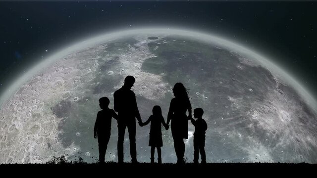 A Silhouette of a Lovely Family Standing on the Edge and Watching on the Traveling Moon Around the Earth. A Close Up of the Slowly Spinning Moon. Moon Rising Over the Horizon on Sky Up.