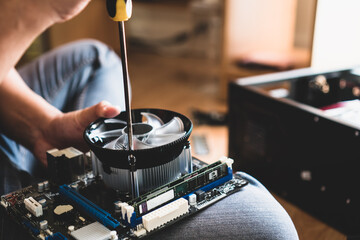 Technician checking by screwdriver held computer repairing mainboard comp hardware, repairing for...