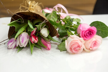 Delicate pink roses as background. Retro filter. Soft color. Bouquet of flowers for the design of postcards, invitations, congratulations on the holiday, birthday